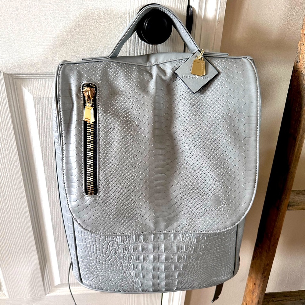 Tote&Carry vegan leather backpack